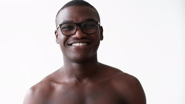 Smiling Energetic Happy African Guy Skincare