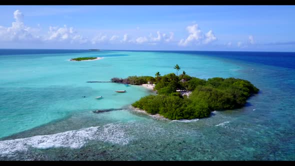 Aerial panorama of relaxing coast beach voyage by shallow ocean with white sand background of a picn