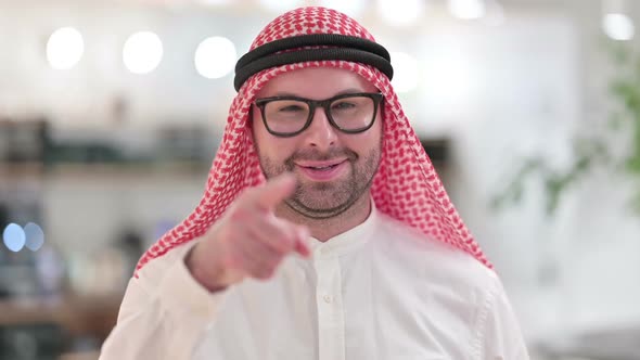 Assertive Young Arab Businessman with Pointing at the Camera