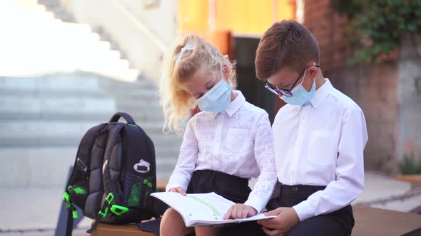 Anonymous School Friends with Textbook Studying During Quarantine Time
