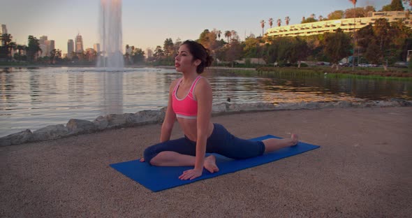 Woman Doing Yoga In The Park At Dawn