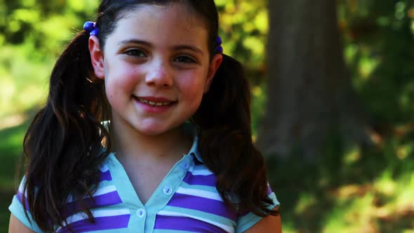 Portrait of a girl standing in the park