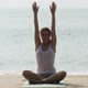 Woman practicing yoga by the sea - VideoHive Item for Sale