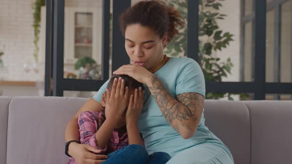 Loving Mother Consoling Troubled Little Daughter