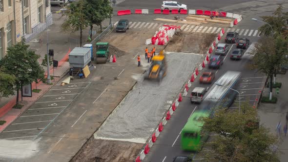 The Bulldozer Moves and Spreads the Soil and Rubble on the Road Timelapse.