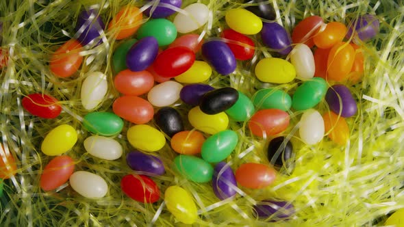 Rotating shot of Easter decorations and candy in colorful Easter grass - EASTER 009