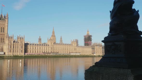 Reveal of The Houses of Parliament with “Big Ben” and the Victoria Tower at the River Thames in Dece