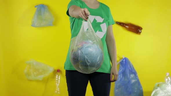 Unrecognizable Woman with Earth Globe in Plastic Package. Save Ecology. Plastic Nature Pollution