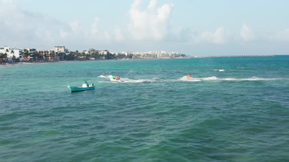 Couples Finishing Their Jet Ski Ride and Cruising Back to the Beach