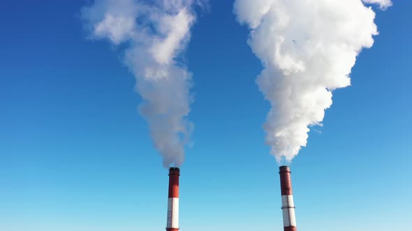 Smokestack with White Smoke Smoking into the Sky