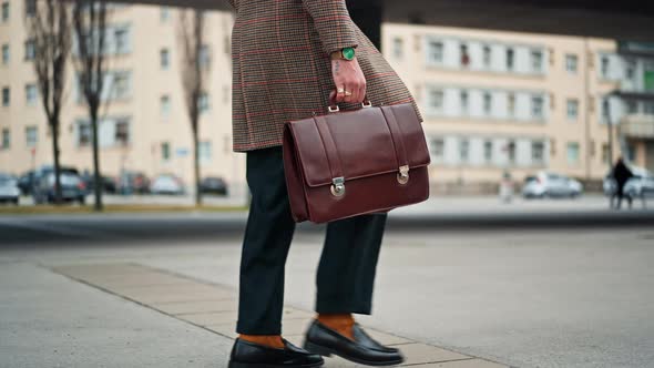 Midsection Businessman Going to Work By Walk He Has a Leather Briefcase in His Hand