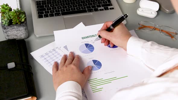 Business woman hands working with documents close up