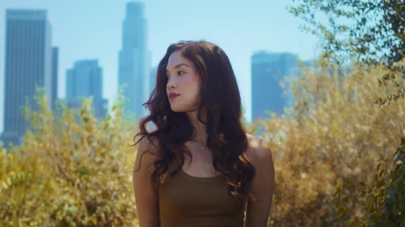 Girl Looking on Camera Confidently Standing in Park