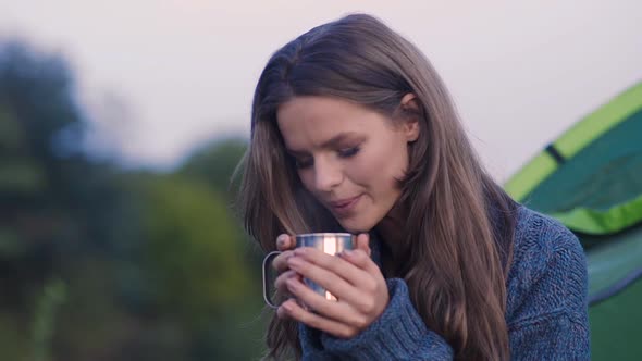 Camping. Tourist Woman Drinking Hot Beverage In Nature