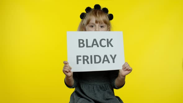 Child Girl Showing Black Friday Inscription, Smiling, Looking Satisfied with Low Prices, Discounts