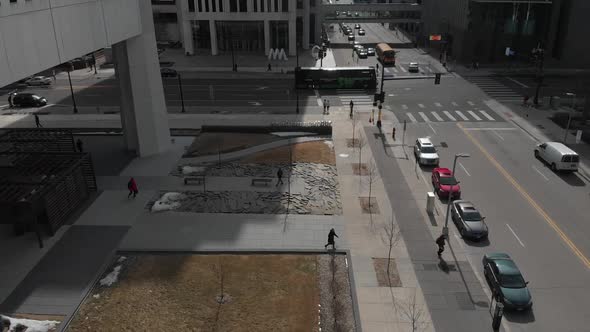 people and cars going by at downtown Minneapolis