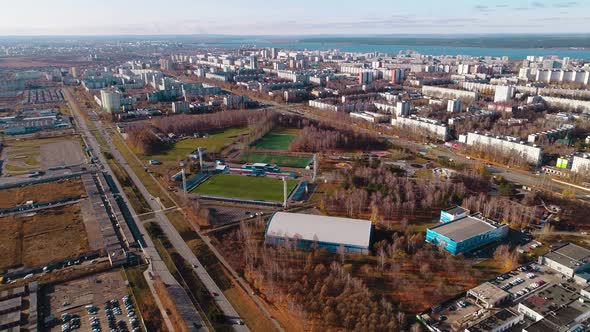 Large Football Field and Sports School Building in City