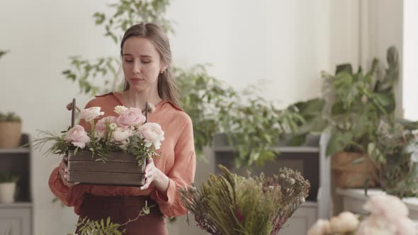 Caucasian Woman Posing with Flowers in Basket