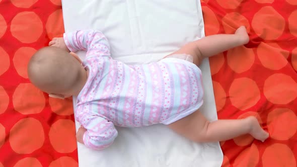 Newborn Baby Girl on Blanket Top View
