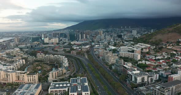 Wide Aerial Shot Tracking Forward Into the City of Cape Town During a Spectacular Sunset with Table