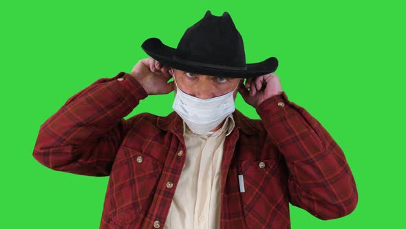 Cowboy Wears Medical Mask To Prevent Corona Virus on a Green Screen, Chroma Key