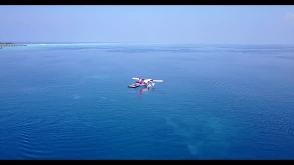 Aerial drone view nature of perfect island beach voyage by transparent sea with white sandy backgrou