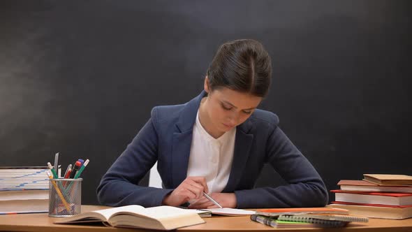 Young Lady Teacher Checking Schoolchildrens Assignments, Occupation, Paperwork