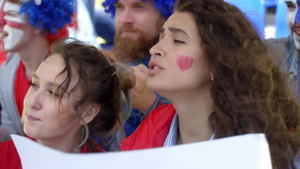 Two Female Supporters Cheering then Looking Disappointed