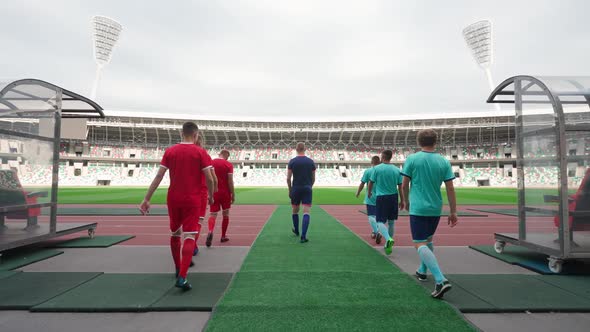 Professional Football Players Walks to the Stadium Rival Football Teams Walk Through the Stadium