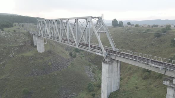 Tsalka, Georgia - August 28 2021: Aerial view of railway bridge in Tsalka