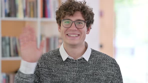 Portrait of Young Man Waving, Welcoming