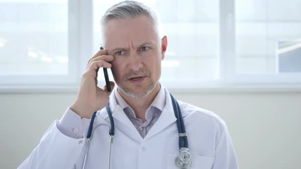 Doctor Discussing with Patient During Phone Talk