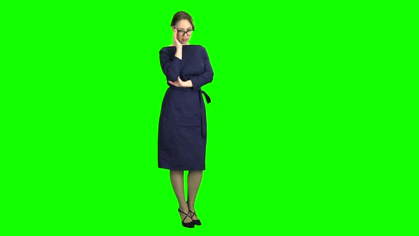 Girl Posing and Adjusting Glasses. Green Screen