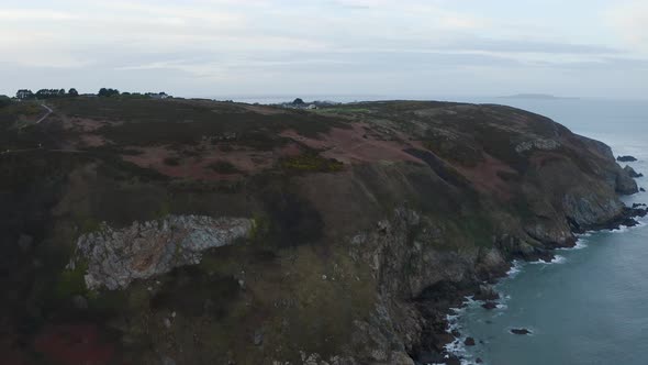 Aerial view of the beautiful cliffs of Howth during a cloudy day