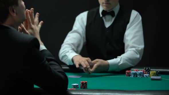 Upset Man Having Bad Combination in Poker, Throwing Cards on Table, Weak Hand