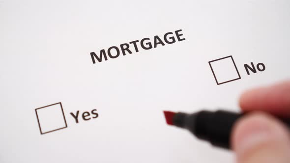 A hand puts a check mark next to YES on white paper under the word MORTGAGE