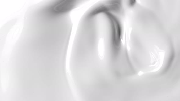 Super Slow Motion Shot of Swirling Milk Background at 1000Fps.