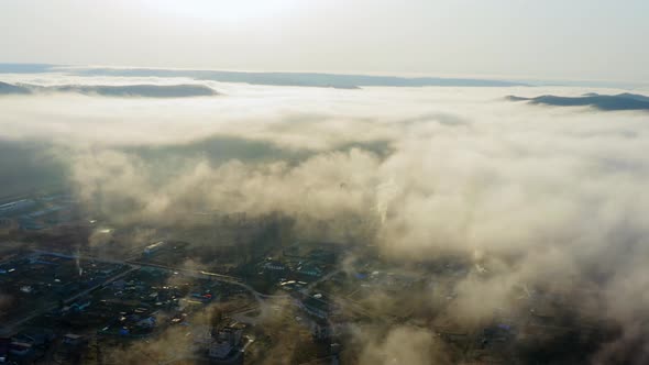 Flight Over the Valley Covered with Morning Mist in the Countryside