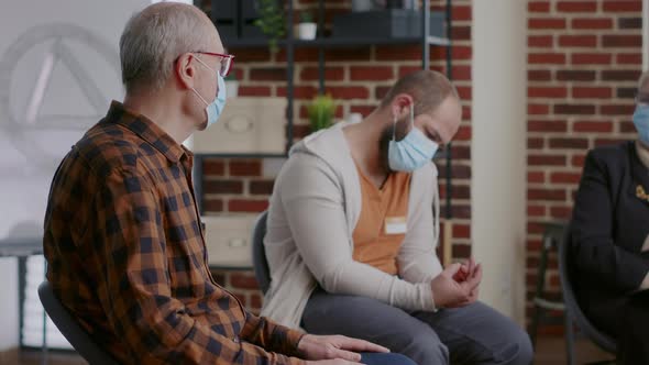 Close Up of Old Person Talking About Alcohol and Drug Addiction at Aa Group Therapy Session