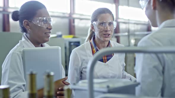 Female Engineers Talking and Laughing at Work