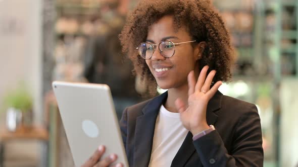 African Businesswoman Doing Video Call on Digital Tablet 