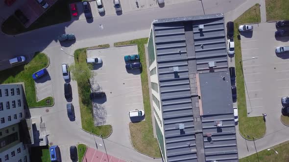 Aerial birdseye view of crowded residential district apartment building rooftops on a sunny summer d