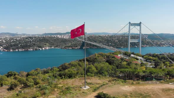 Aerial view of Fatih Sultan Mehmet Bridge and Turkish Flag