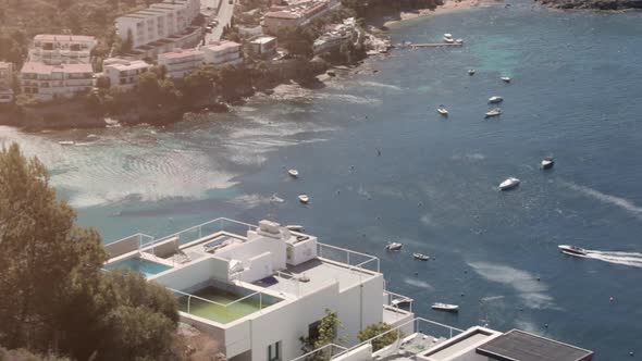 Panorama, luxurious houses by Spanish European coast next to beach with ocean views. Roses, Coasta B