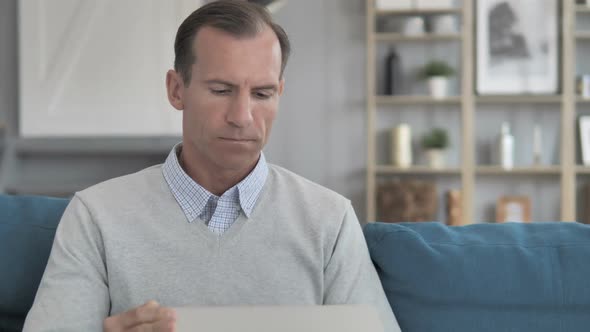 Middle Aged Man Leaving Creative Workplace After Completing Work