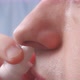 A Person Injects the Medicine Into the Nose Closeup - VideoHive Item for Sale