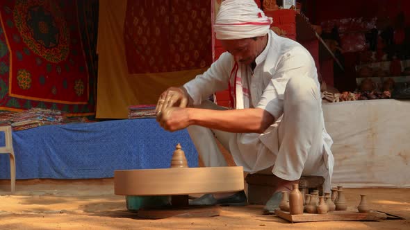 Potter at Work Makes Ceramic Dishes