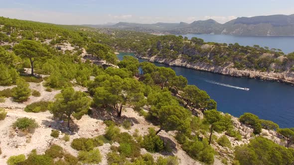 Aerial travel drone view of clear green water, cliffs of Cassis, Mediterranean Sea, Southern France.