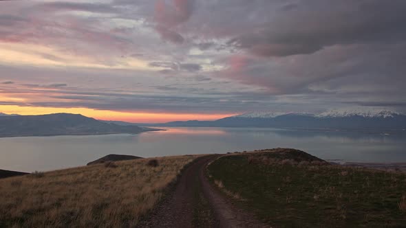 Looking down dirt road as the light fades at sunset