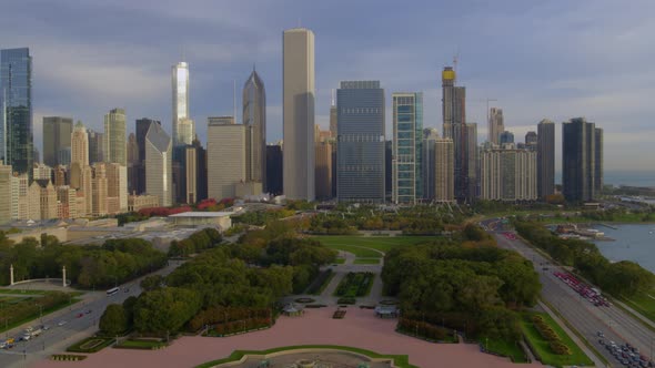 Aerial of park, street and beautiful Chicago skyline at dusk